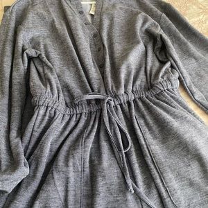 Greyish blue jumpsuit. Never worn. Good for a taller person. Cute w/heels